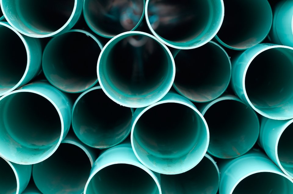 Stacked new plastic water pipes