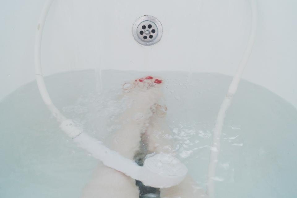 A bath filling with hot water